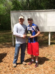 Paul presenting Tyler with the Open Pistol 1st place award