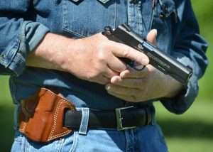 The author practiced drawing the Model 1911 using a Galco Combat Master belt holster .