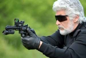 The author prepares to test fire the fully equipped 327 TRR8 with added optics and tlight laser combination.