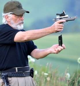 The magazine is positioned to go into the beveled magazine well of the Tanfoglio Gold Custom…
