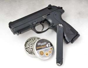 The 8+8 round pellet/BB magazine inserts into the front portion of the grip frame.