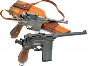 The details in the Umarex Model 712 Broomhandle Mauser are clearly evident when compared to an original Mauser model shown with the detachable shoulder stock holster.