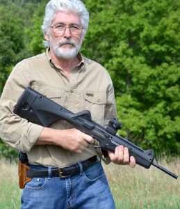 Even in the 21st Century, a rifle at the ready and a handgun worn in a belt holster still pair up the same as they did in the Old West.