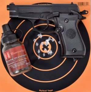 Fired offhand from 21 feet, the Model 84 SF put 10 Hornady Black Diamond .177 caliber black anodized steel BBs into the 10 and X rings at 1.25 inches including multiple overlapping hits.