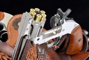 Like the S&W models, the .177 caliber air pistol has the automatic cartridge ejector actuated by breaking open the gun and tilting the barrel down. Since the BB cartridges can be reloaded, you don’t want them flying out of the cylinder, so the ejector stops short, allowing them to be dumped or removed by hand. If you use the speed loader that comes with the extra cartridges, it is designed for the Webley airgun. In order to load the Schofield, you have to hit the center release with your finger (holding the speed loader with the cartridges upright) and then dump them into the cylinder. It’s slower than a normal speed loader but still faster than one round at a time.