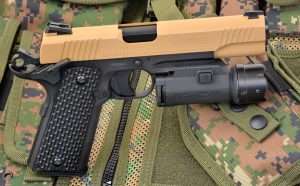 The 1911’s Picatinny rail is the same size and design as the .45 ACP M45 CQBP used by elite Marine Corps special operations units since 2012. The Umarex is shown with a Walther Night Force tactical light/laser combination.