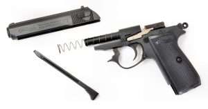 Both the airgun and the cartridge gun have blowback actions with barrels fixed to the frame and the recoil spring surrounding the barrel. Field stripping is accomplished the same way with both by removing the magazine, pulling down on the triggerguard to release the slide, drawing it to the rear, lifting it up over the hammer, and then sliding it forward off the barrel and recoil spring.