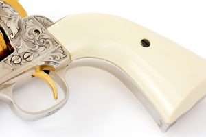 A close look at the front of the gripstrap reveals the AA signature that appears on Adams & Adams hand engraved firearms, thus making this Colt licensed Peacemaker .177 caliber revolver authentic right down to the engraver’s signature.