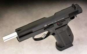 The airgun has a nickel finished metal smoothbore barrel, and the action locks back on an empty magazine. The slide release and thumb safety are identical to the 9mm model. The left side of the slide is also correctly marked CAL.9 PARA and bears the CZ logo.