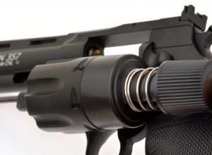 When the cartridges are inserted into the cylinder, the speed loader is pushed forward and a release on the front of the speed loader is activated dropping all six rounds at once.