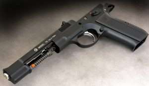 In this view showing reassembly, note how the CZ-75 design slide fits inside the frame (rather than over it), and rides on internal rails.