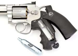 Both the Dan Wesson and S&W model air pistols have grips that slide back for loading the CO2 cartridge. The turn key to seat the CO2 is integral with the grip frame.