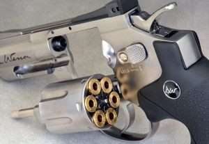The metal pellet shells are stamped DAN WESSON around the rims. The frame-mounted cylinder release lever also functions as a manual safety by pulling it to the rear.