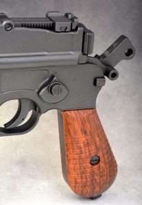 The Umarex Legends Model 712 has the correct manual thumb safety lever which either locks the hammer back so it cannot drop, or prevents it from being cocked if down. The selector switch on the left side has a locking button, press it in and rotate the selector from N (semi-auto at the top) to R (full auto to the right).