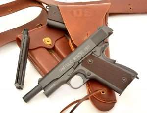 By the start of World War II, the Colt 1911A1 was in the holsters of every U.S. soldier and officer issued a sidearm. Once again, the Tanfoglio is a perfect fir for the past and present. (JT&L 1917 design U.S. military holster and 1911 double magazine pouch reproduced by World War Supply)