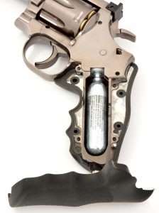 The hex head wrench just slides into the base screw to tighten the CO2 until it is pierced. It is a very efficient design unique to the Model 715 that allows the use of accurately-sized grips and frame.