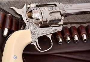 One of the surfaces on a Colt that is often the subject of great detail is the loading gate. Also note the scrollwork between the cylinder flutes, along the bottom of the frame and rear of the triggerguard.