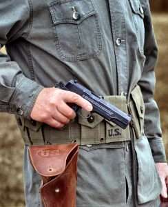 For the gun test the author carried the John Wayne 1911A1 in a weathered reproduction of the WWII era 1911 holster. This is the same type of holster used by John Wayne in WWII movies.