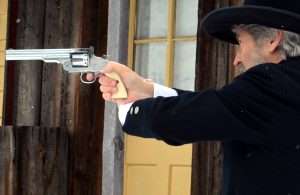 The shooting tests were done from a distance of 25 feet and fired using a two-handed hold, as opposed to this Old West supported stance (once used by Wild Bill Hickok in a long distance shootout) with the shooting hand supported on the opposite arm.