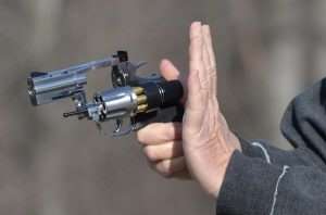 The speed loader feeds the six cartridges into the cylinder. Once in, pressing the knob with the thumb will push the speed loader forward activating the release of all six rounds.