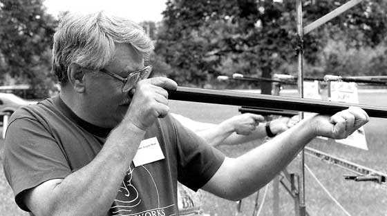 man shooting air cane