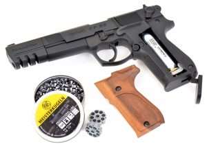 The base of what appears to be the bottom of a magazine is actually the CO2 seating device. The ambidextrous right side magazine release is actually used to press out the left grip panel for loading the CO2 into the grip frame. With the grip panel removed, the CO2 is loaded into the channel and the thumb screw tightened. Closing the seating lever pieces the CO2 and makes the gun ready to fire.