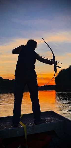 bowfishing at sunset