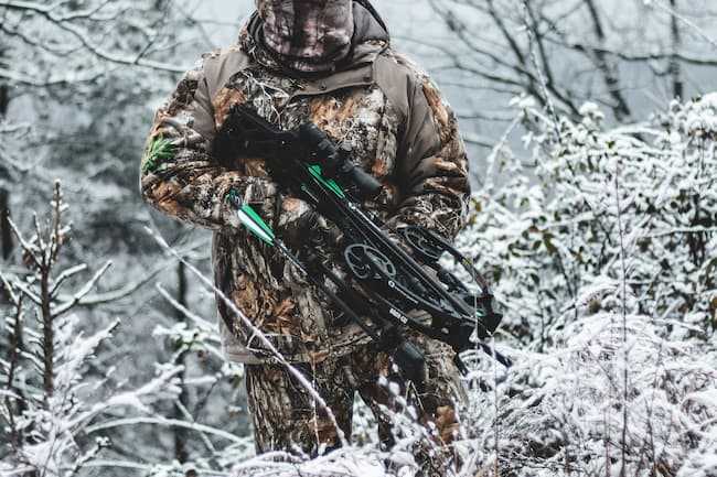 Crossbow hunter in the snow