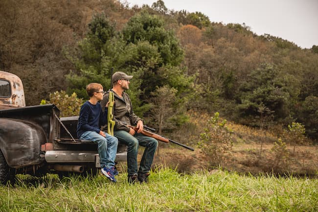 Dad and son unplug by shooting air rifles on the farm.