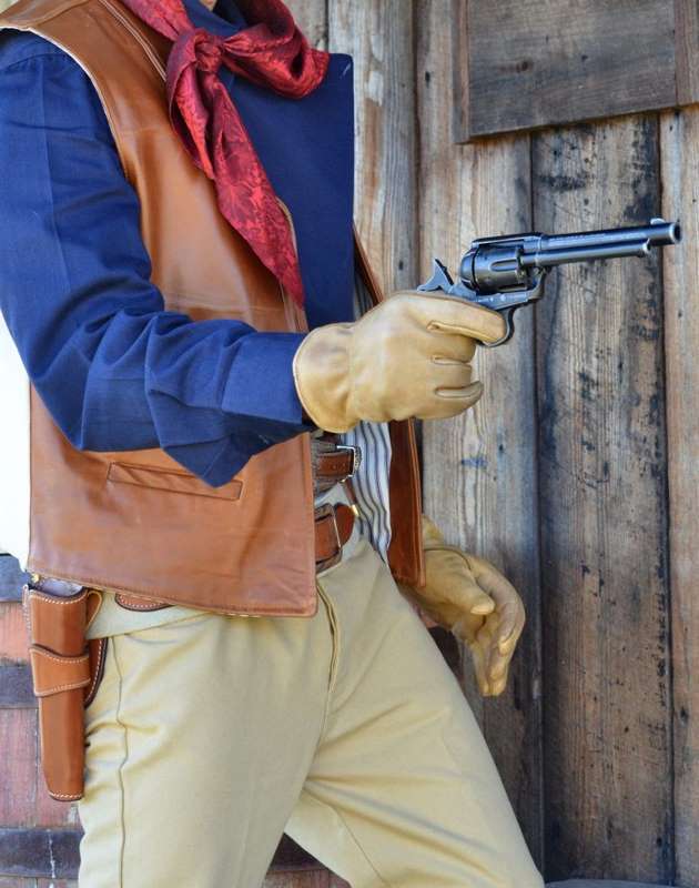 Wearing a copy of the famous "Duke" rig worn by JOhn Wanyne in many of his films, the author quick draws the limited editon "Duke" Model SAA. (Holster by John Bianchi Frontier Gunleather)