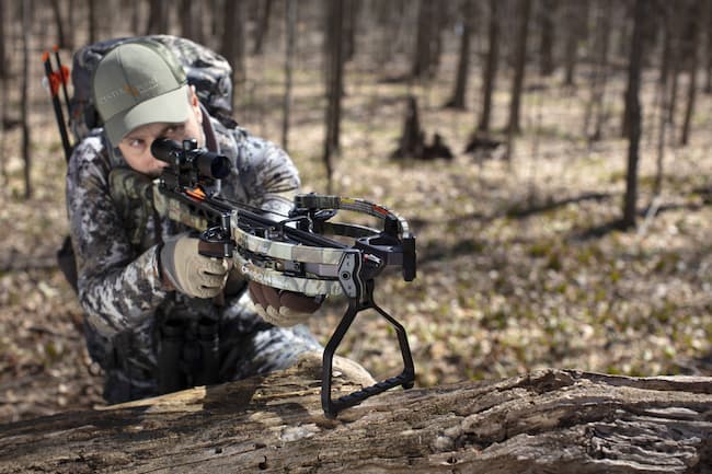 archer using a crossbow with built-in stirrup/rest