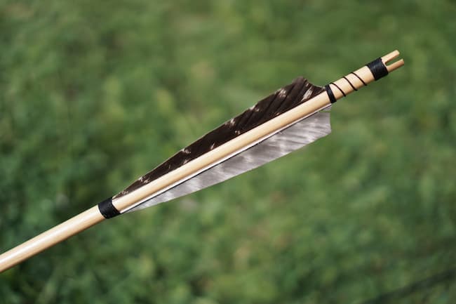 close up view of hand made arrow fletching