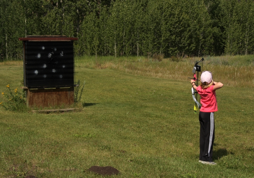 teaching archery skills to youngsters