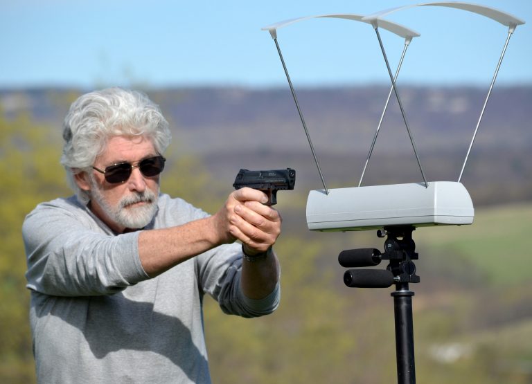 Dennis Adler shooting through a chronograph.