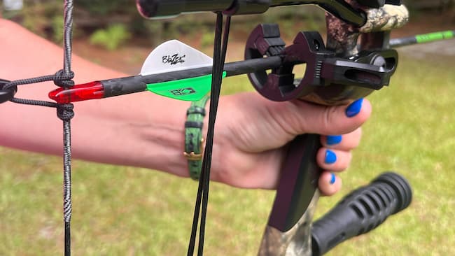 image of bow with the focus on the rest and arrow with nock on the string.