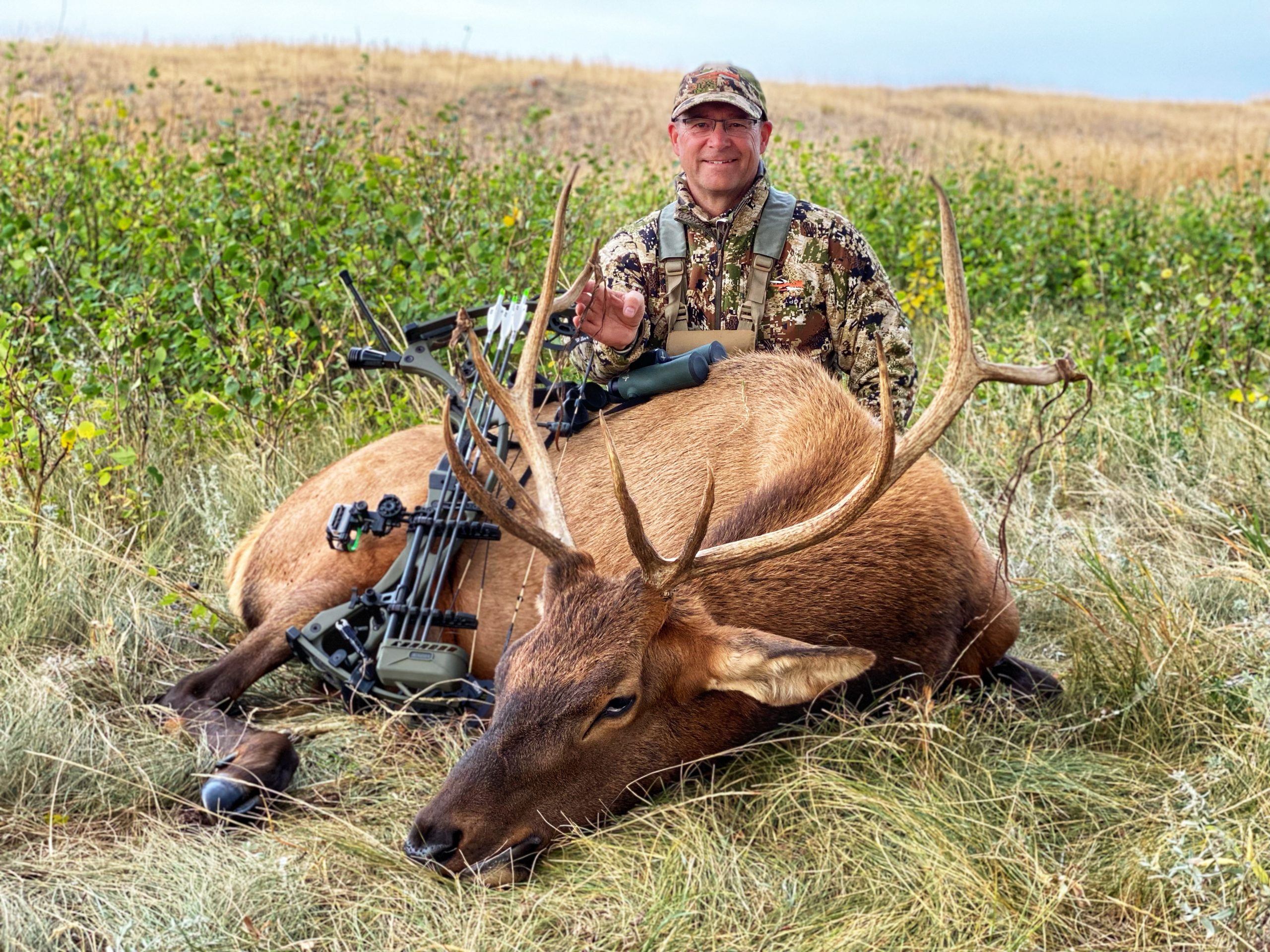 Kevin wilson with deer harvest using a compound bow setup