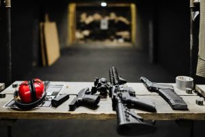 table set with guns and ear muffs
