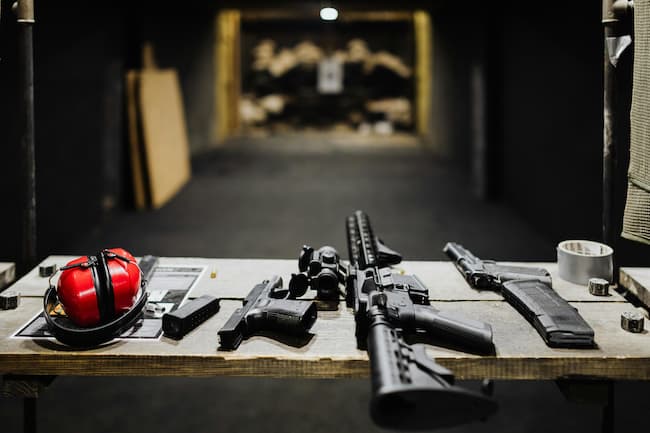 table set with guns and ear muffs