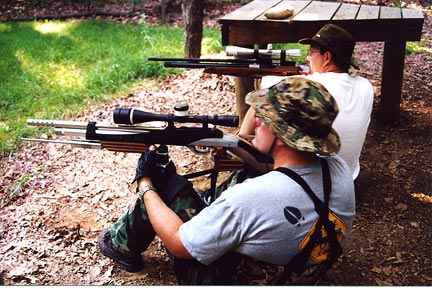 Field target shooters sight-in their guns before a match